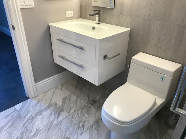 Floating Wash Area In A Bathroom With Western Toilet