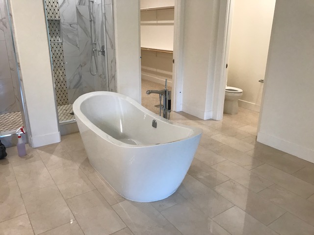 A Side View Of The Bathtub in The Bathroom