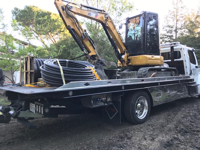 Excavating And Tree Removal Machine On The Truck