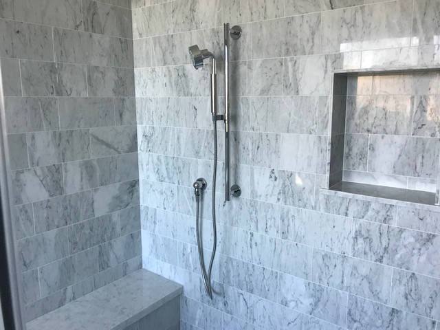 A Microphone Shower On The Bath Wall