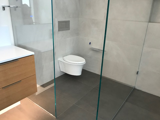 A Western Toilet Covered With Glass