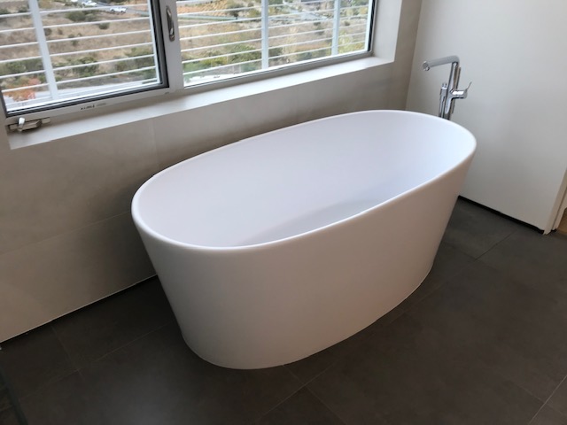 A Left Angle View of the Bath Tub Near The Window